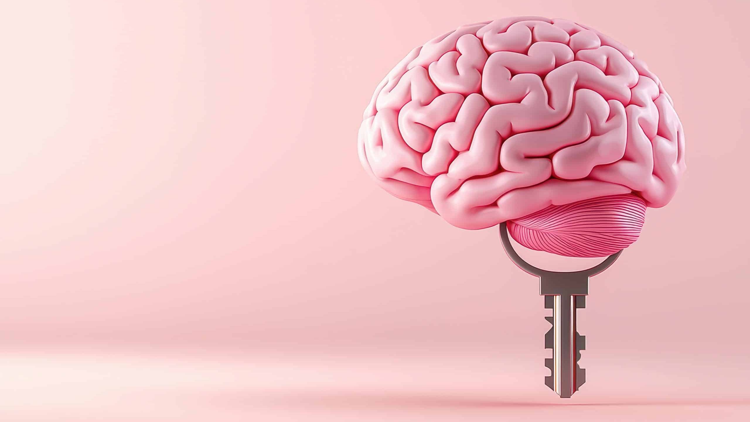 Pink brain with key representing unlocking potential, white isolated background.